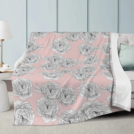 Pink Peony Flower Blanket with hand-drawn floral pattern on a couch, adding elegance and warmth to room decor.