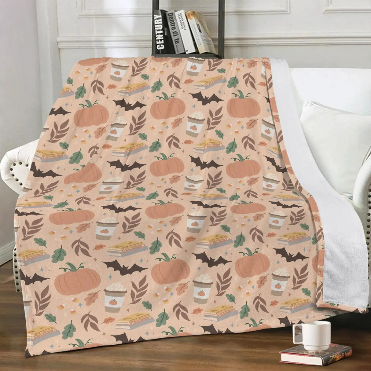 Cozy Pumpkin Patch Fall-Themed Blanket with pumpkins, pie, and leaves pattern on a chair in a cozy room