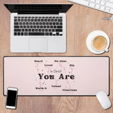 In Christ You Are desk mat on wooden desk with laptop, smartphone, coffee, and keyboard, designed for motivation and comfort.