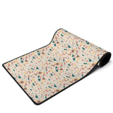 Terrazzo desk mat with a multicolor pattern and anti-slip rubber base, providing a stylish and functional addition to any workspace.