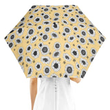 Person holding Sunflower Umbrella with vibrant sunflower pattern, perfect for rainy days and UV protection.