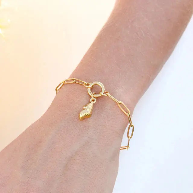 18K gold charm keeper bracelet with delicate chain and small charm details, crafted by Winks Design Studio LLC.