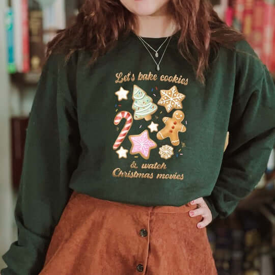 Cozy green crewneck sweatshirt with festive cookie design for baking and holiday movie watching.