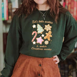 Cozy green crewneck sweatshirt with festive cookie design for baking and holiday movie watching.