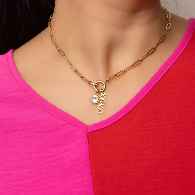 18K gold PVD stainless steel XOXO charm dangle jewelry from Winks Design Studio,LLC, with a script design and stylish appearance.