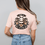 Woman wearing Bee-utiful Day short sleeve T-shirt with hand-drawn bee design and "Have a Bee-utiful Day" message on the back.