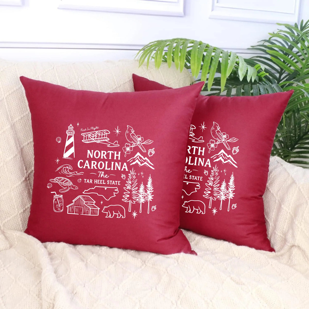 North Carolina State Pillow by Winks Design Studio, LLC featuring a decorative pillow with the state’s map and design elements.