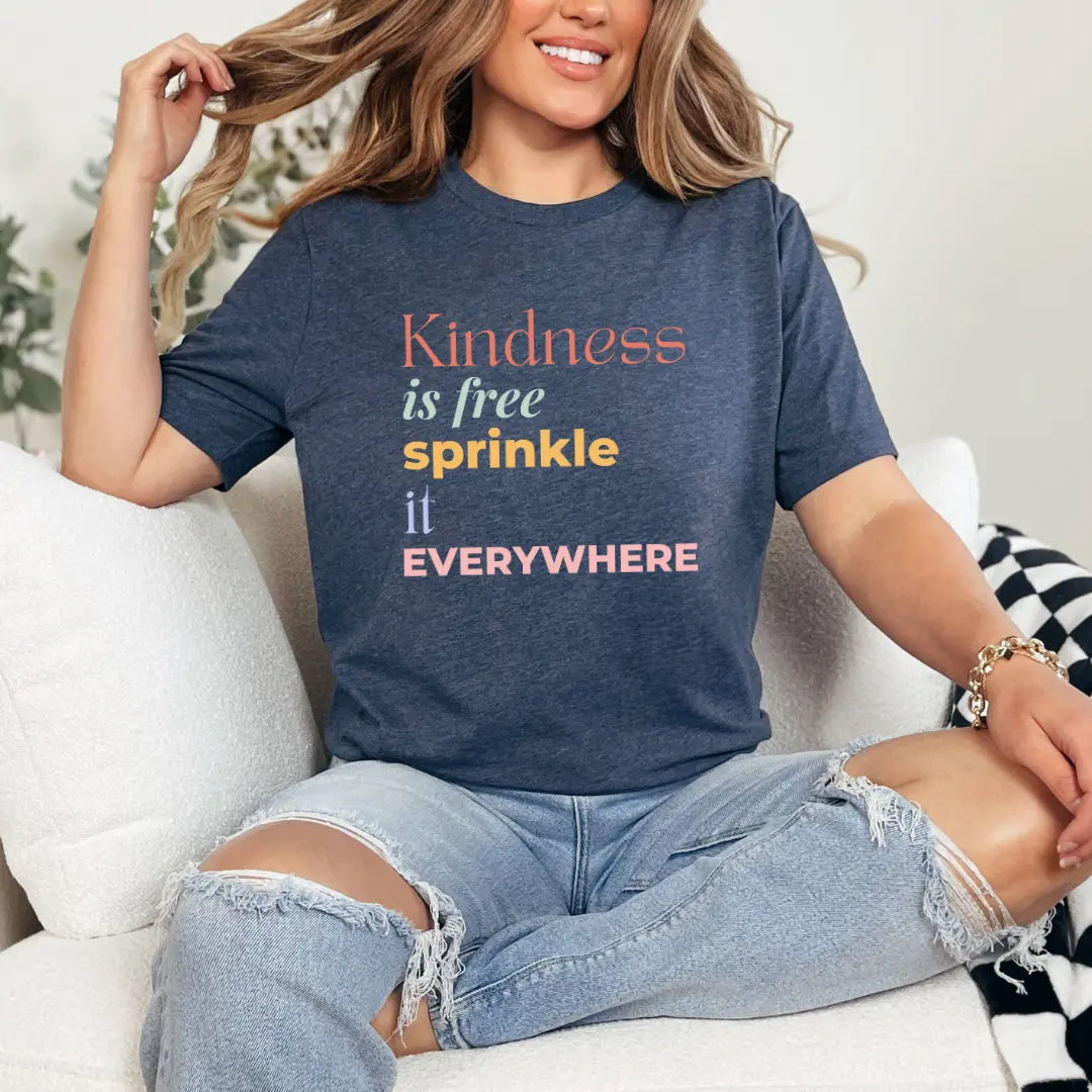 Gray T-shirt from Winks Design Studio, LLC featuring the "Kindness is Free Sprinkle it Everywhere" graphic in a casual style.