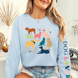 Woman wearing Dog Lover Crewneck featuring colorful dog silhouettes, showcasing affection for dogs, premium cotton and polyester blend.