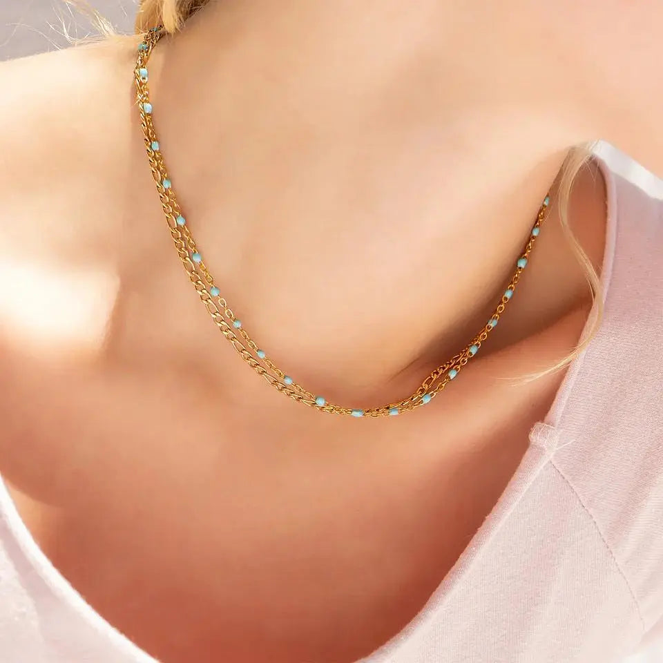 18K gold turquoise chain necklace from Winks Design Studio, LLC featuring a sleek gold chain with vibrant turquoise accents.