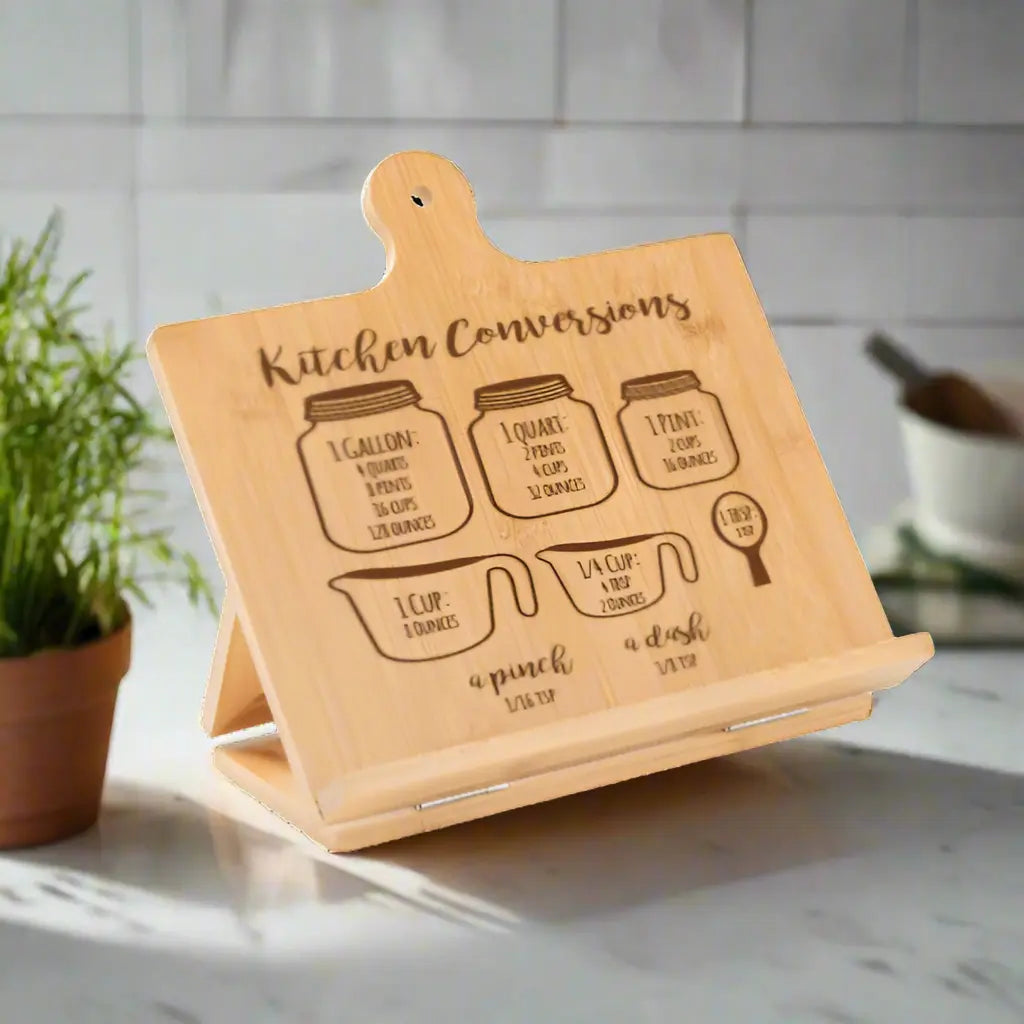 Custom engraved bamboo cookbook stand by Winks Design Studio, LLC, featuring a natural bamboo finish and sturdy book holding design.