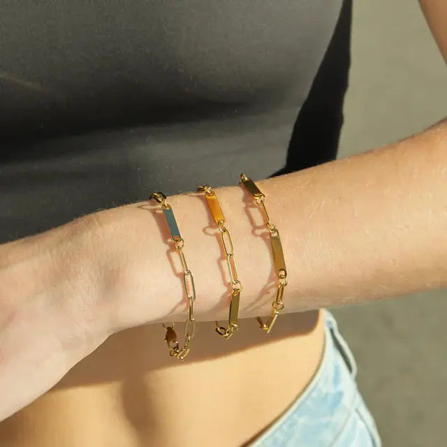 18K gold engravable 3 bar bracelet from Winks Design Studio, LLC, featuring sleek gold bars with space for custom engravings.