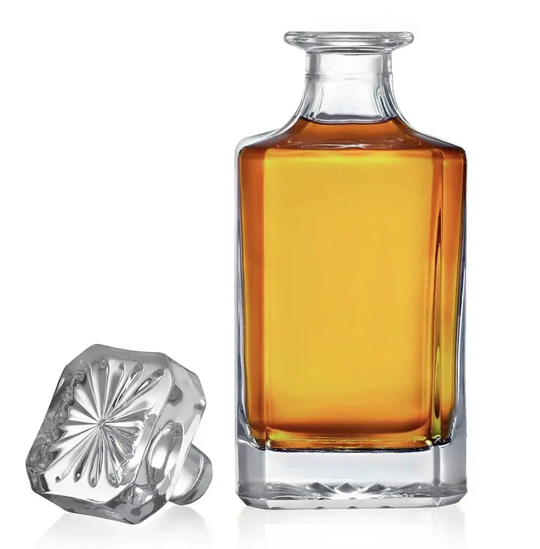 Custom engraved glass decanter from Winks Design Studio, LLC, featuring a clear, elegant design with personalized engraving.