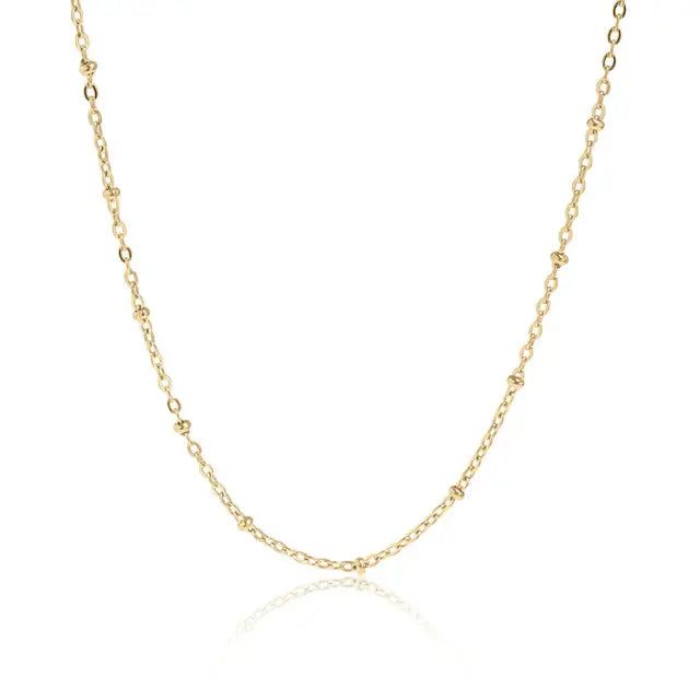 18K gold satellite chain necklace with small, round links, featuring a sleek and shiny finish from Winks Design Studio, LLC.