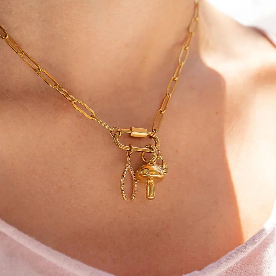 18K gold mushroom charm from Winks Design Studio, LLC featuring a detailed and polished mushroom design for jewelry accessories.