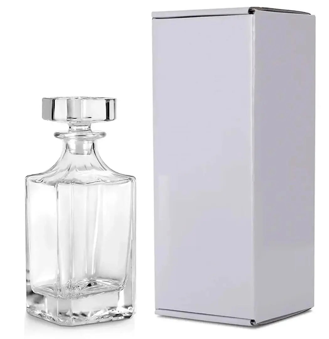 Custom engraved glass decanter from Winks Design Studio, LLC, with a sleek, clear design perfect for storing and serving spirits.