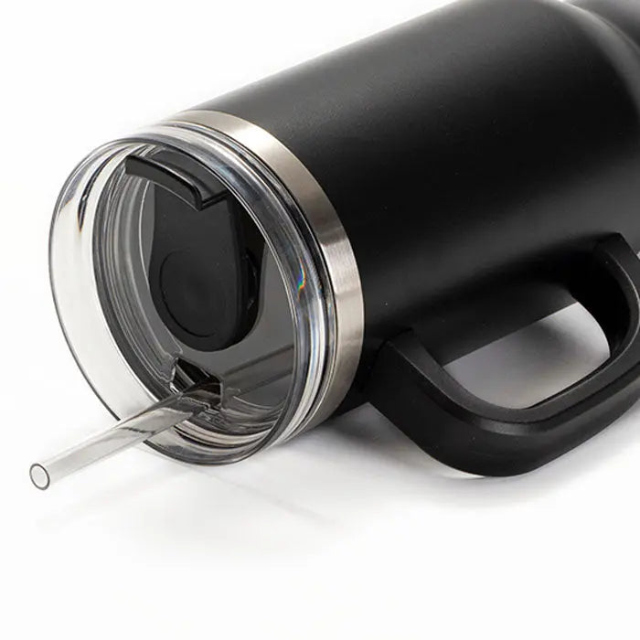 Close-up of a black 40oz powder coated tumbler with handle from Winks Design Studio, LLC, featuring engraved details.