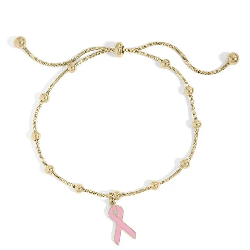 18K gold adjustable bracelet with cancer ribbon charm by Winks Design Studio, LLC, featuring a sleek gold bangle with ribbon detail.