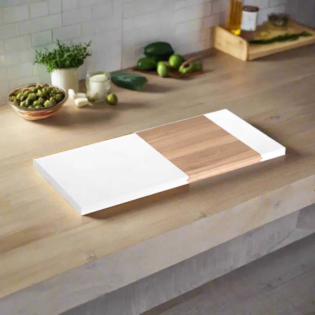 Engraved marble serving board by Winks Design Studio, LLC with acacia wood accents, shown from an angled view.