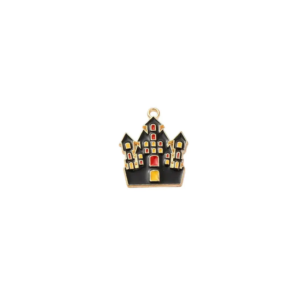 Gold haunted house charm by Winks Design Studio, LLC, featuring intricate details and spooky haunted house design.