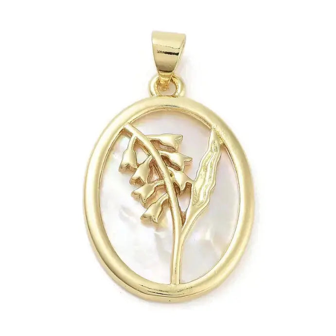 Gold shell floral charm pendant with intricate floral design, crafted by Winks Design Studio, LLC.
