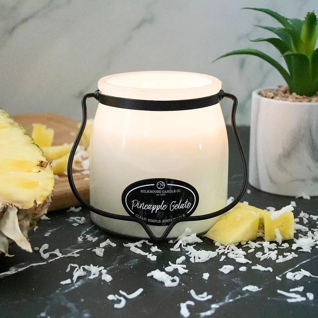 Milkhouse Candle 16oz Butter Jar Candle by Winks Design Studio features a pineapple gelato scent with a cozy, decorative candle in a butter jar.