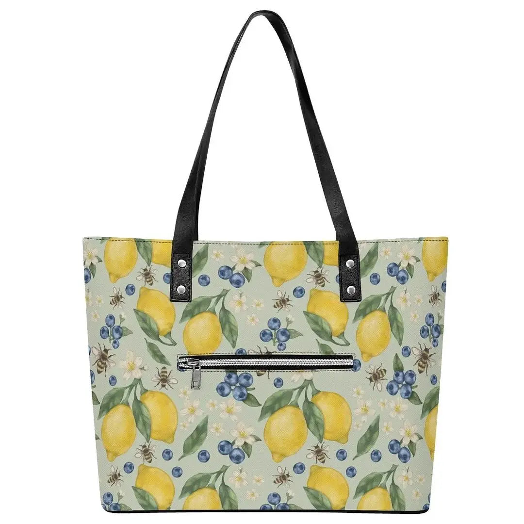 Lemonberry Bloom leather tote bag by Winks Design Studio, LLC featuring a spacious design with floral accents and sturdy handles.