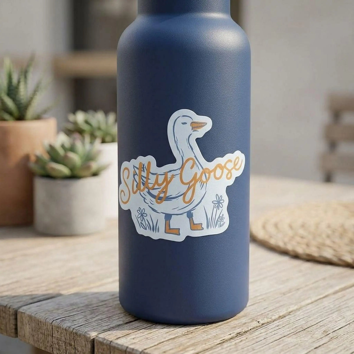 Colorful Silly Goose vinyl sticker by Winks Design Studio, LLC featuring a playful cartoon goose on a transparent background.