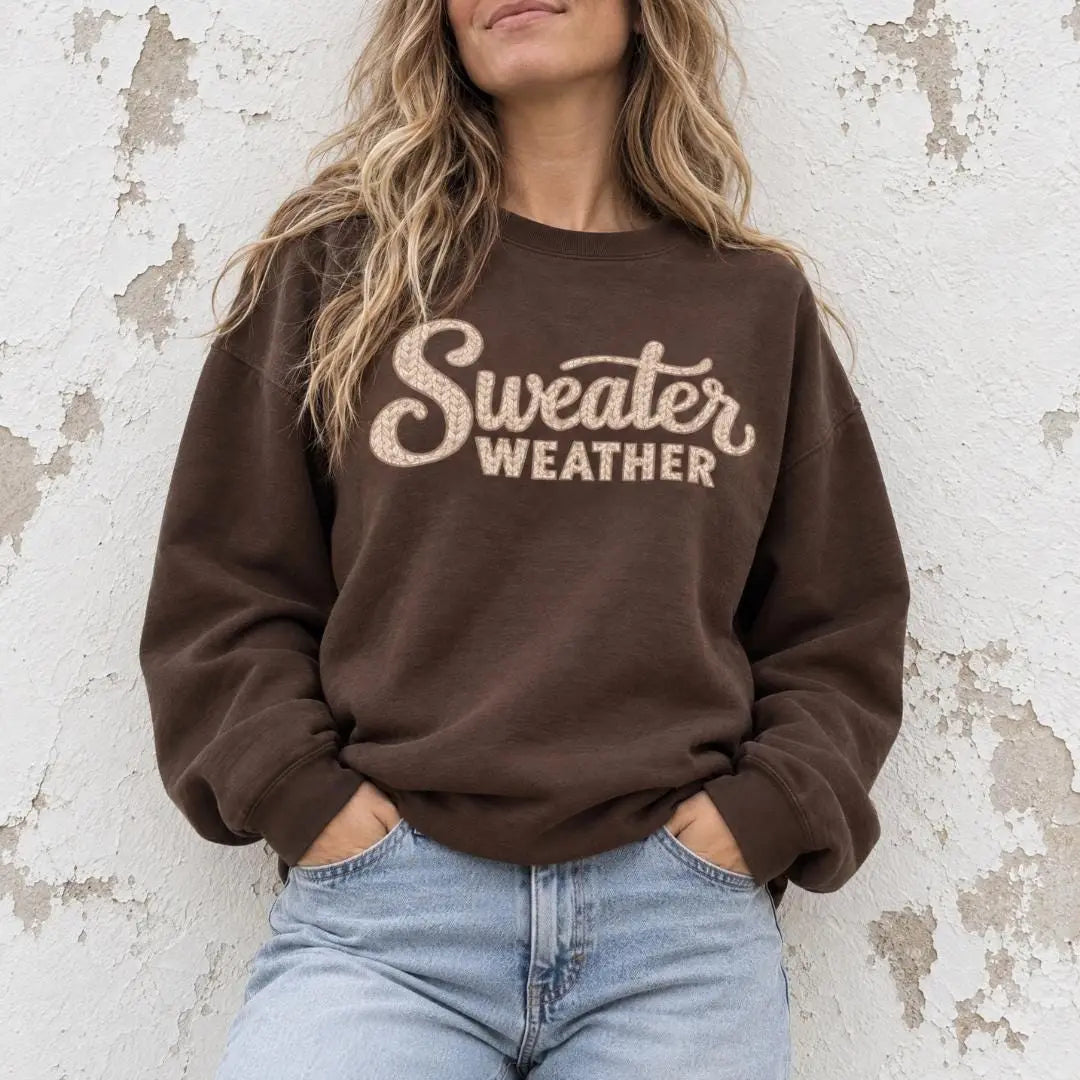 Dark chocolate brown "Sweater Weather" graphic crewneck sweatshirt with tan cable knit textured lettering