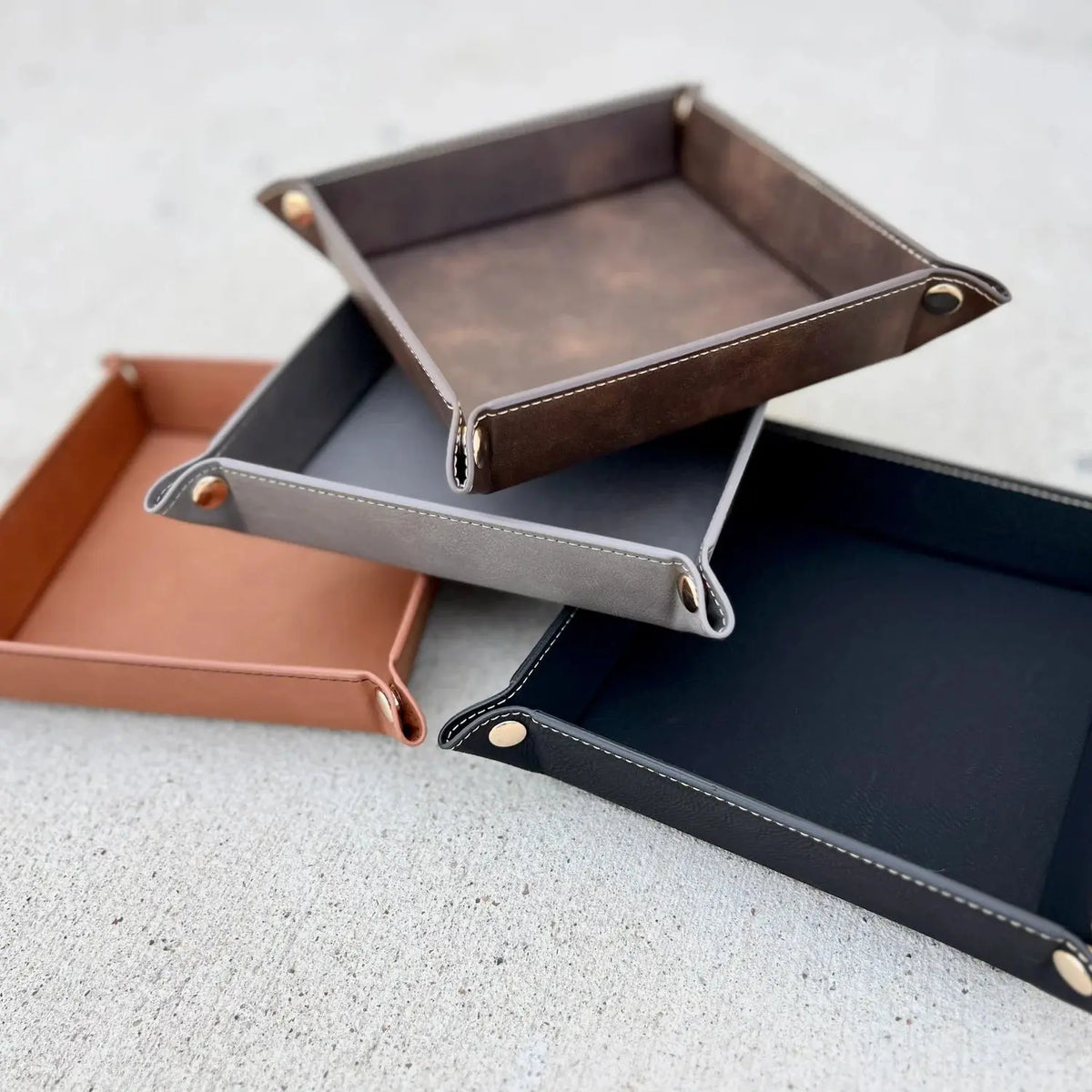 Custom engraved valet tray by Winks Design Studio, LLC, showing a sleek wooden tray with personalized engraved design.