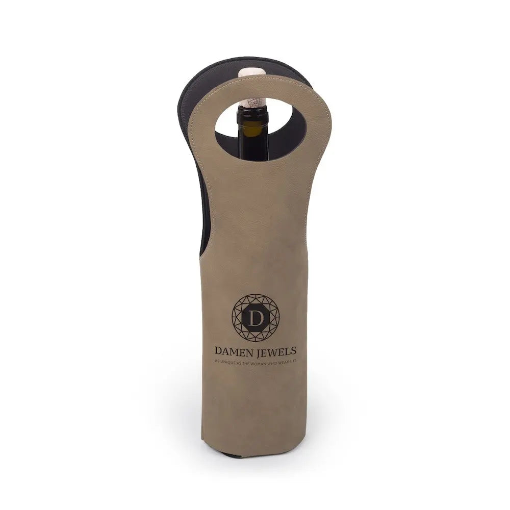 Custom leather wine tote sleeve by Winks Design Studio, LLC, featuring a sleek, handcrafted wine carrier with a secure closure.