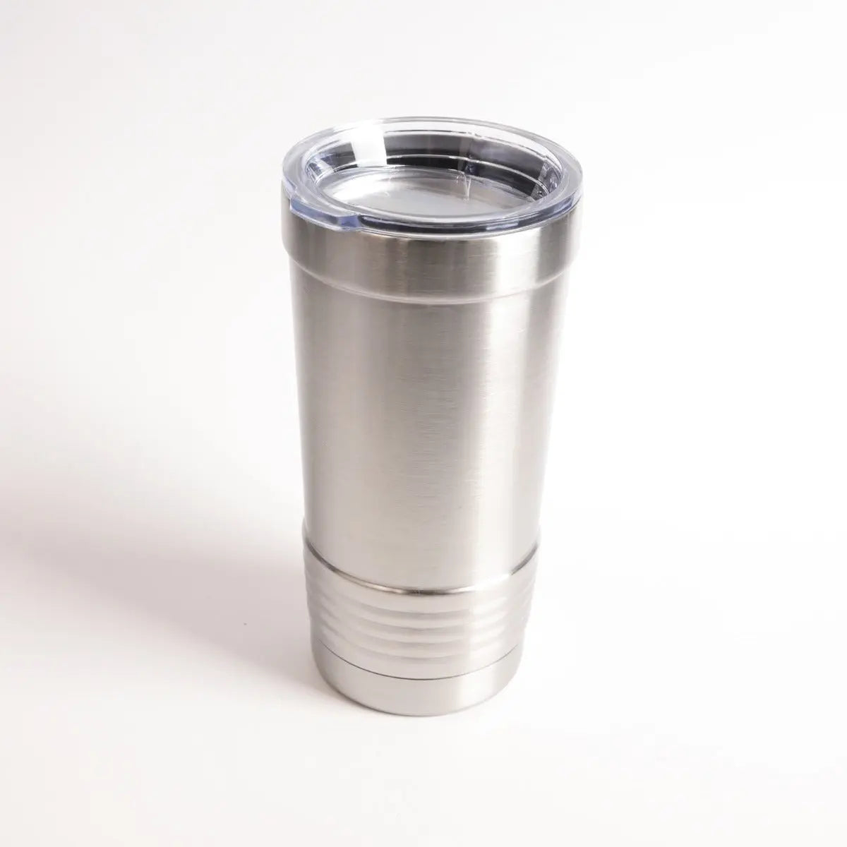 Custom 20oz tumbler with silicone sleeve by Winks Design Studio, LLC, showing the sleek design and textured silicone grip.