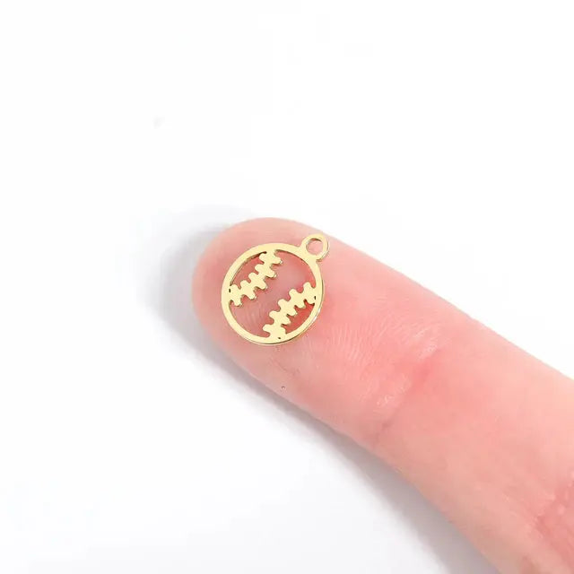 Winks Design Studio sports charm featuring a detailed athletic shoe design on a small metal charm for jewelry or accessories.
