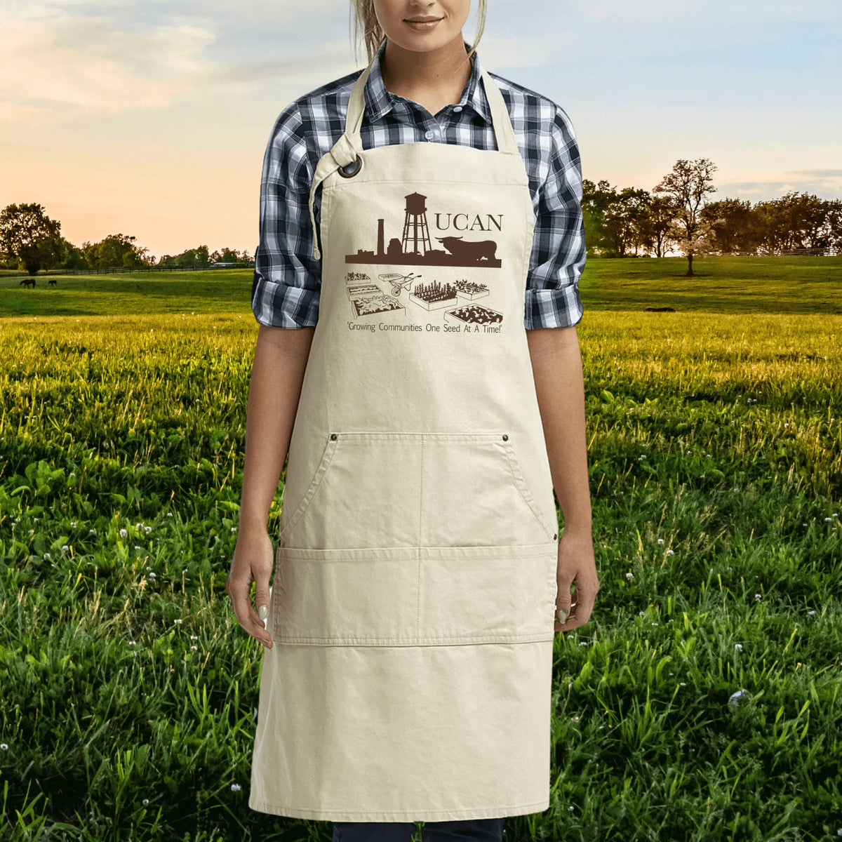 Black UCAN pocketed garden apron by Winks Design Studio, LLC with multiple front pockets for gardening tools and accessories.