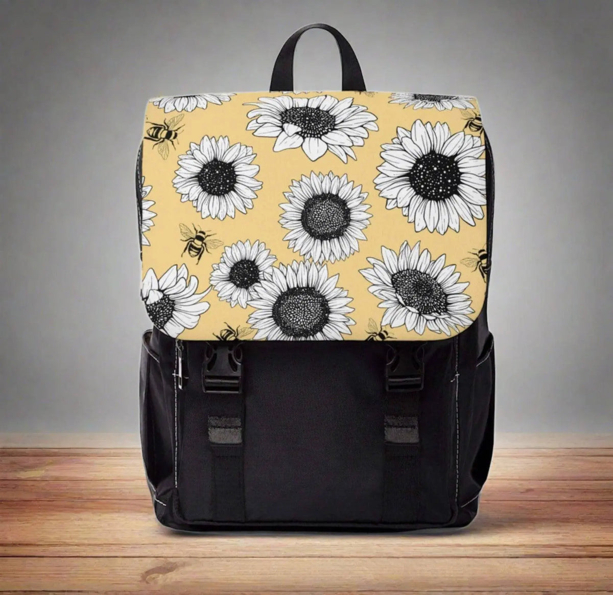 Sunflower-patterned Winks Design Studio LLC laptop backpack with adjustable straps and multiple compartments.
