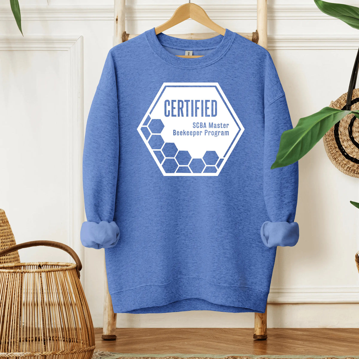 Winks Design Studio LLC SCBA Master Beekeeper Program crewneck in black with embroidered bee and text design.