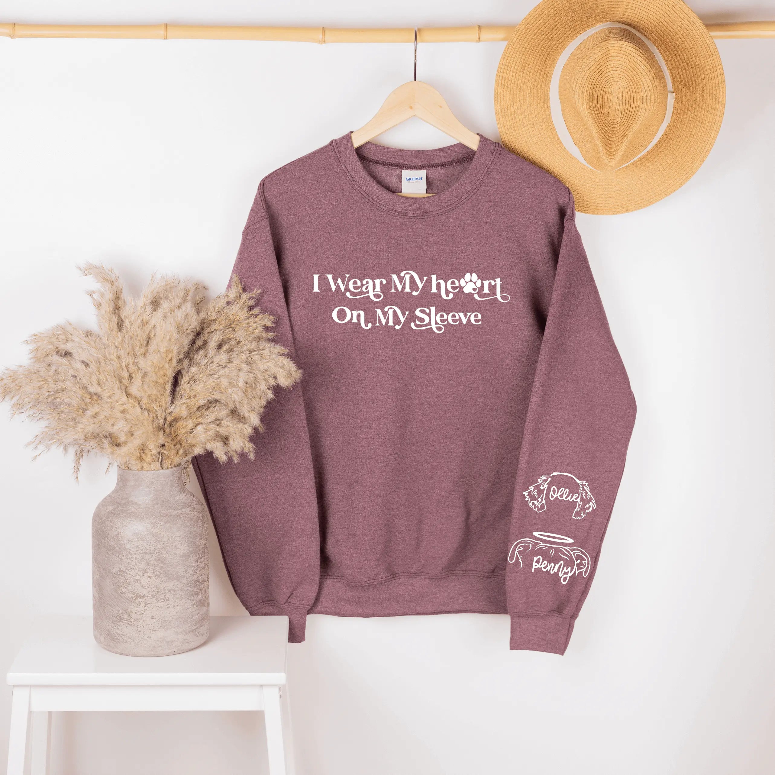 Heather royal crewneck sweatshirt by Winks Design Studio, LLC with "I Wear My Heart on My Sleeve" text and comfortable fit.