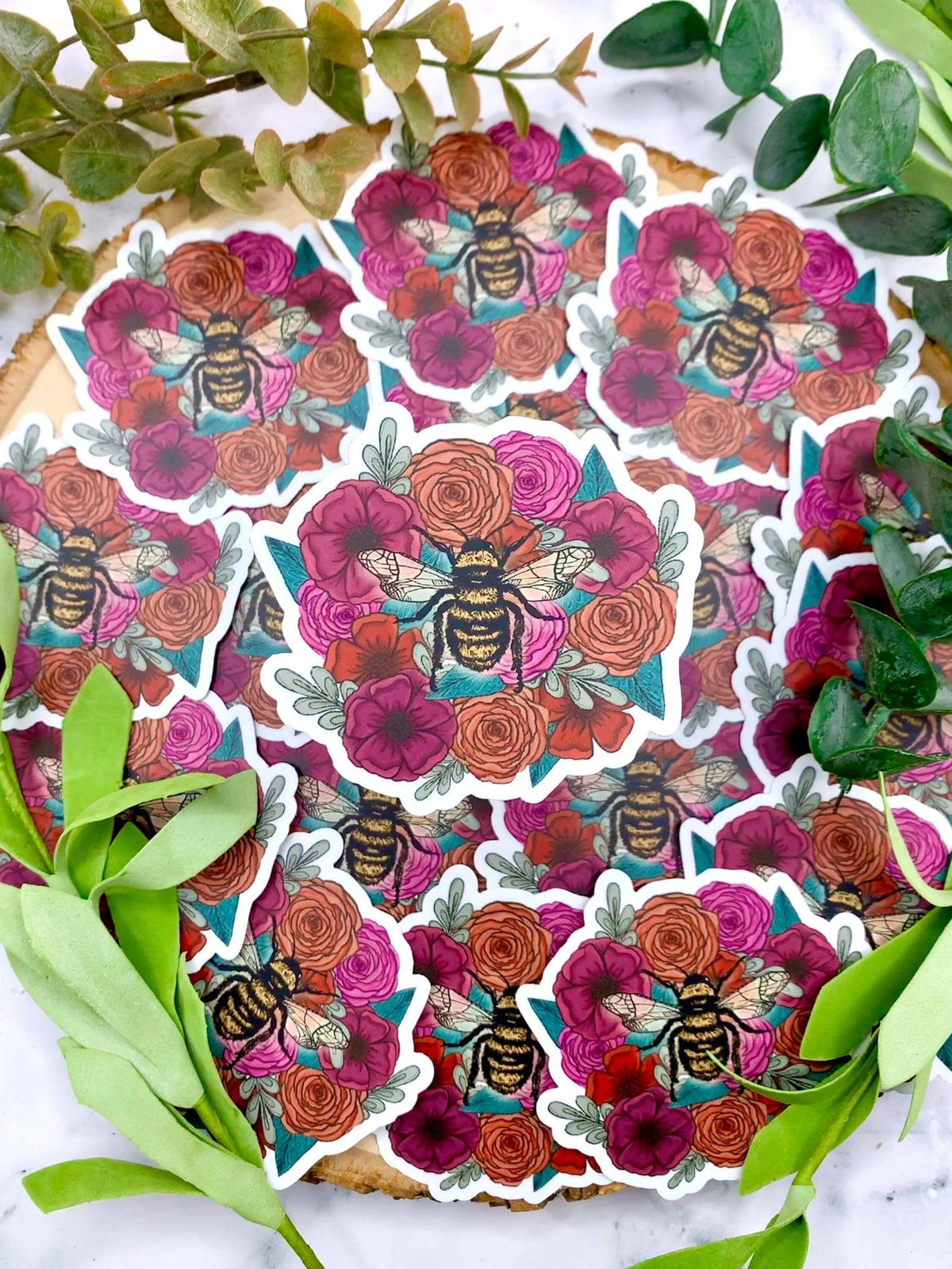 Bee on flowers vinyl sticker by Winks Design Studio LLC, decorative sticker featuring a detailed bee surrounded by blooming flowers.