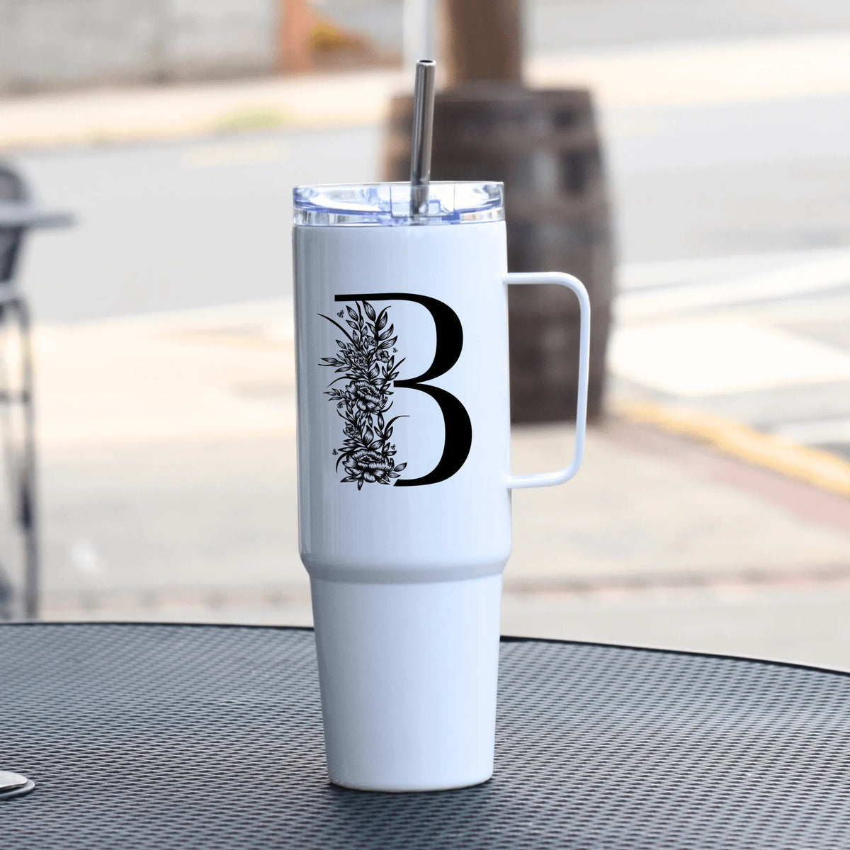 Pink 40oz floral letter tumbler with handle from Winks Design Studio, LLC, featuring custom floral design on drinkware.