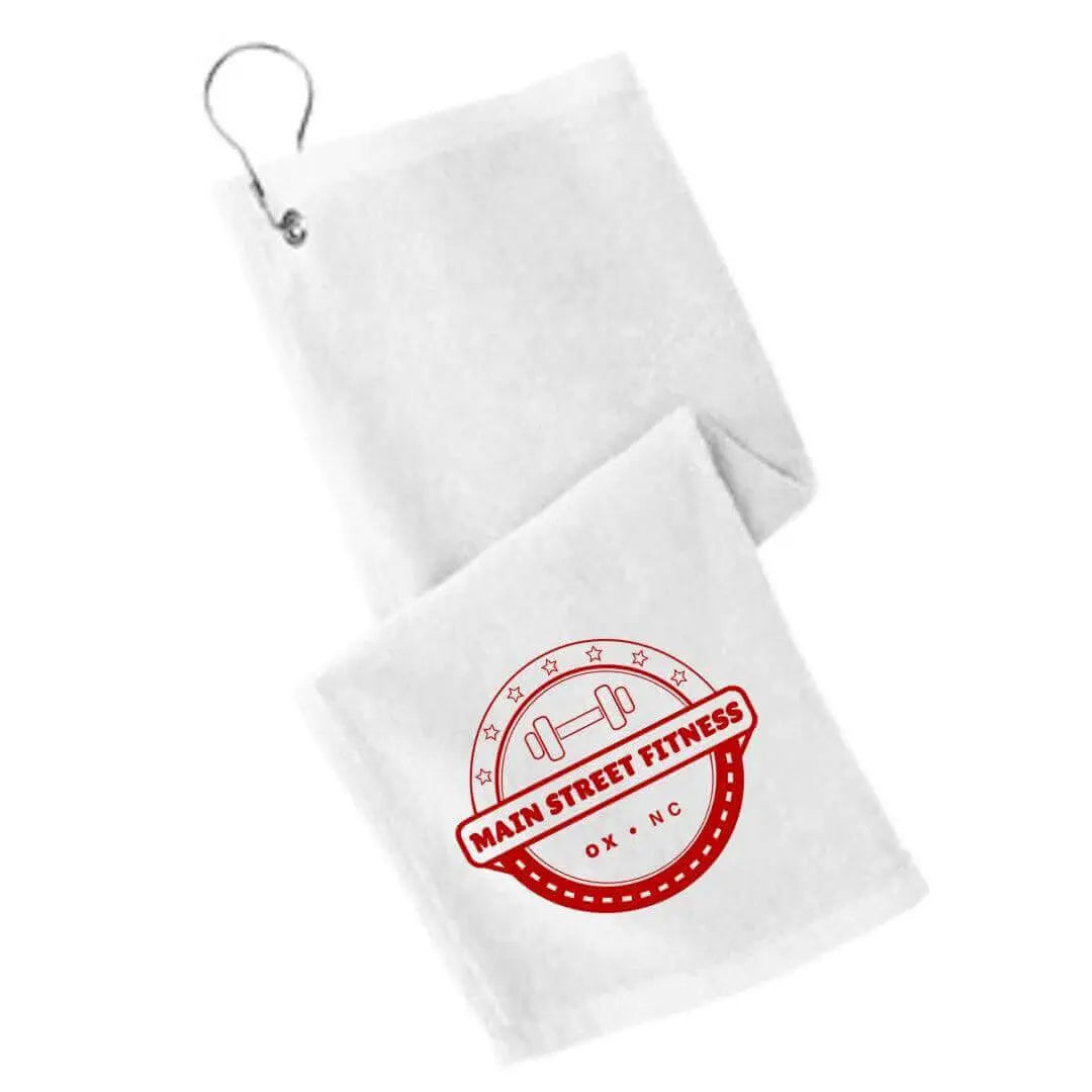 Black Main Street Fitness golf towel by Winks Design Studio LLC with logo embroidery, shown folded on a golf club.