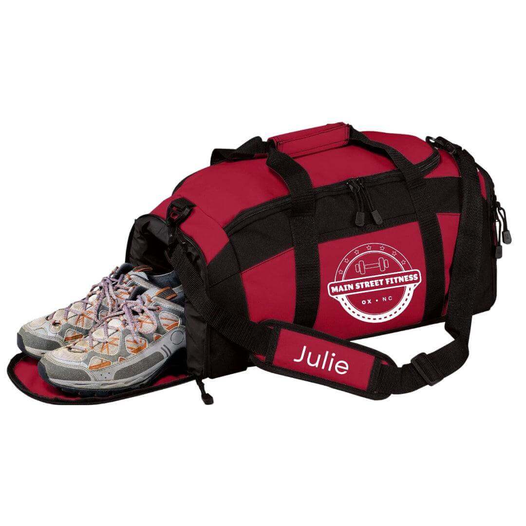 Pink Main Street Fitness gym bag by Winks Design Studio, LLC, with carrying handles and spacious interior for workout essentials.