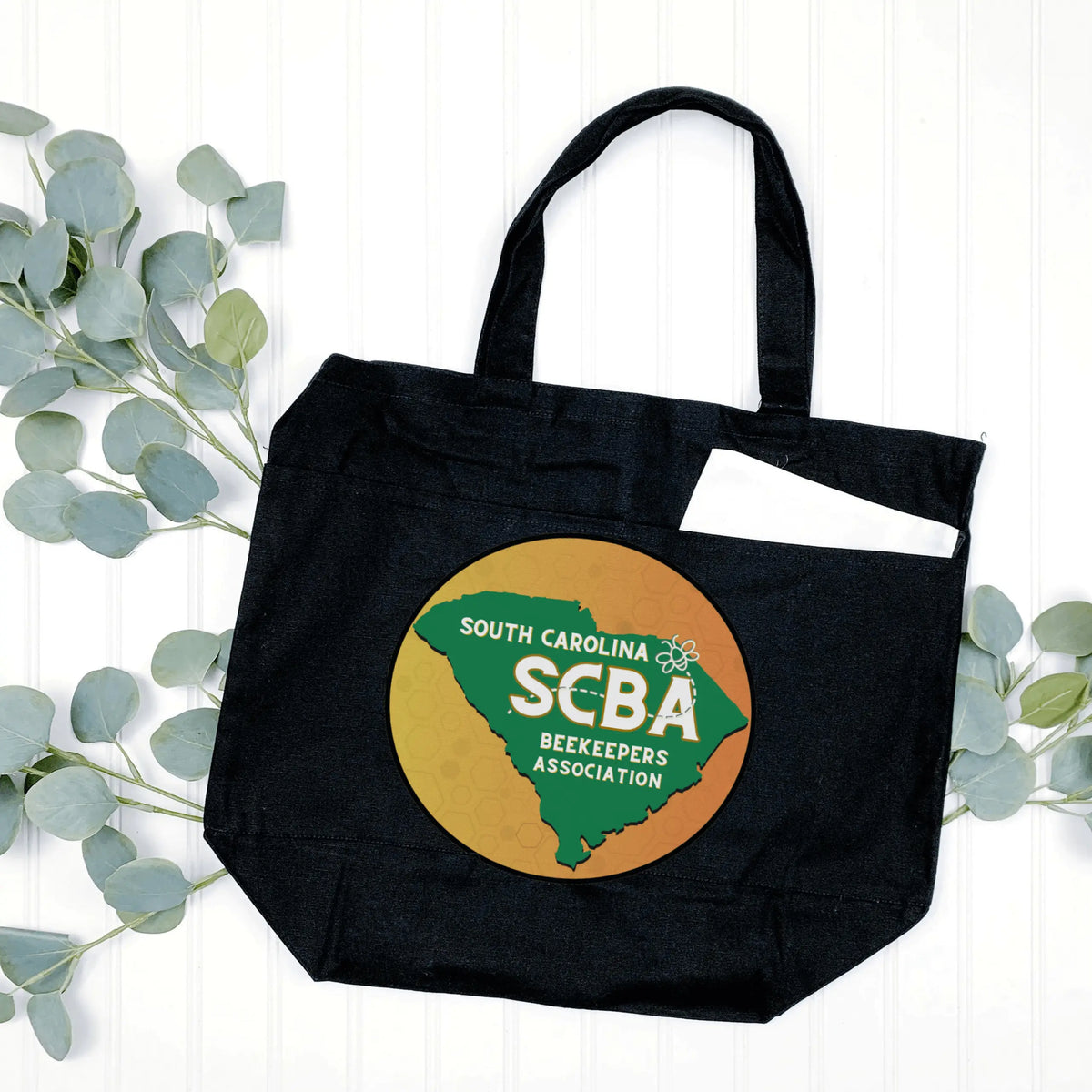 Black SCBA Logo tote handbag by Winks Design Studio, LLC with multiple functional pockets and stylish design.