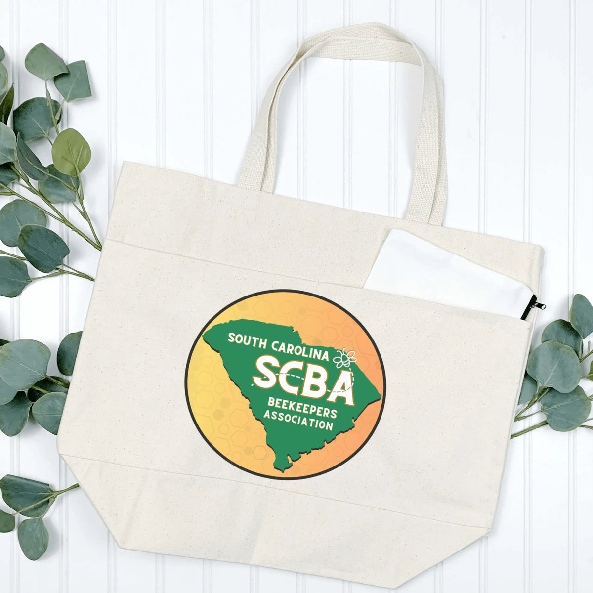 Black SCBA Logo tote handbag with multiple pockets by Winks Design Studio, LLC, featuring a spacious interior and stylish design.