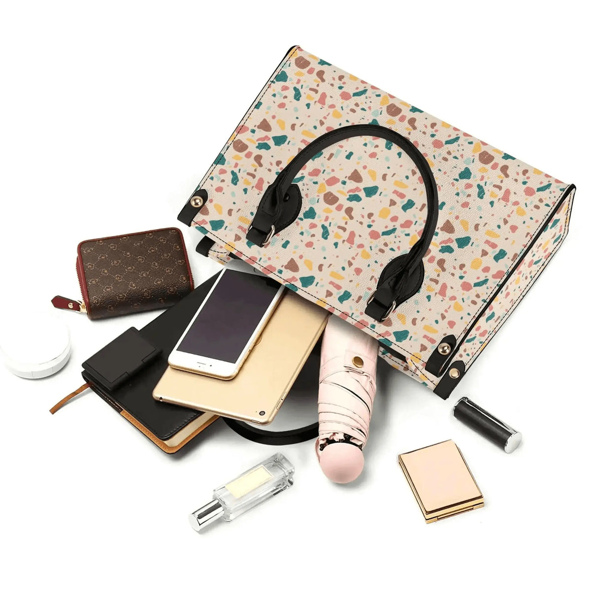Winks Design Studio LLC terrazzo handbag with a colorful, speckled terrazzo pattern and sleek leather accents.