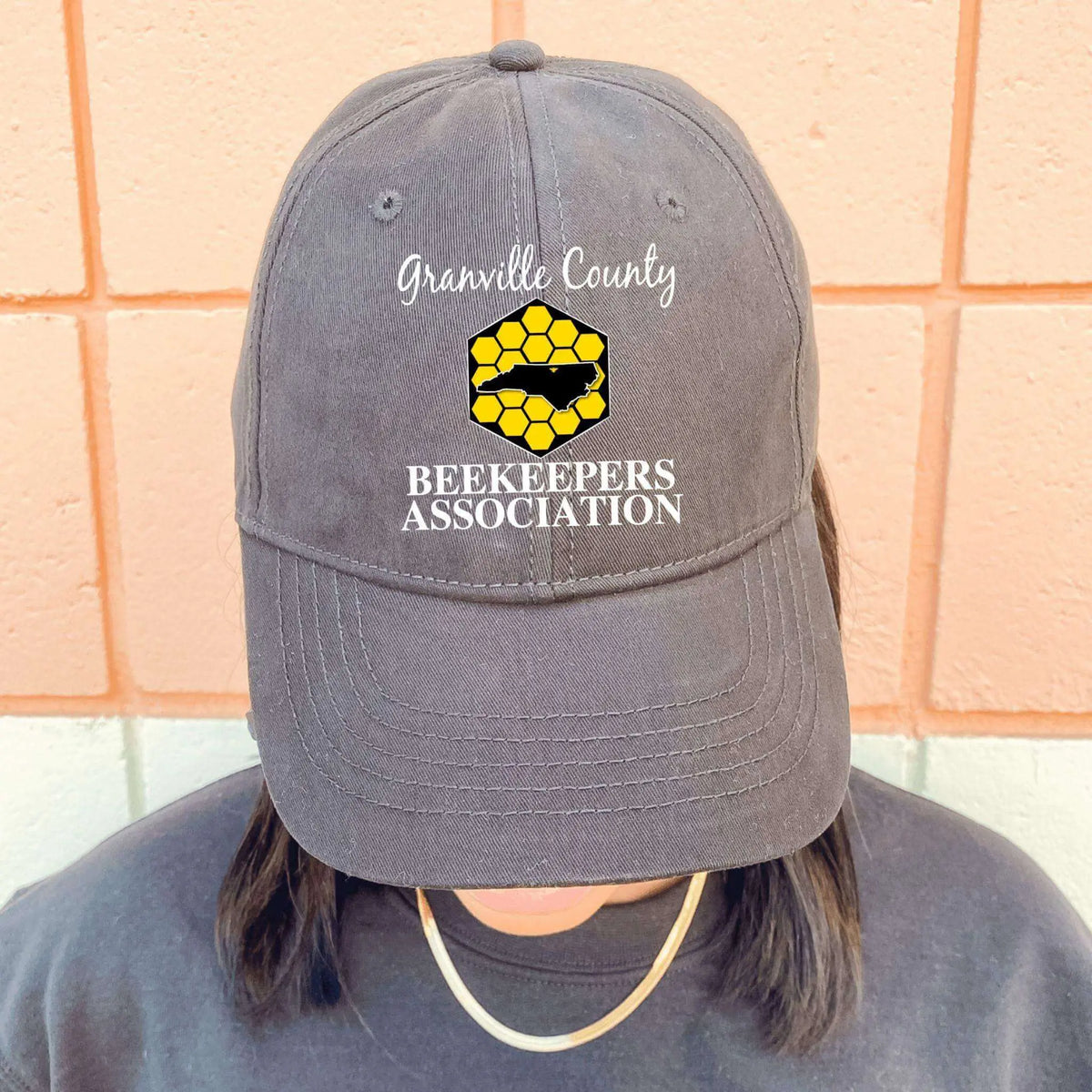 Black GCBA Twill Hat by Winks Design Studio, LLC featuring a structured brim and adjustable strap for a stylish fit.