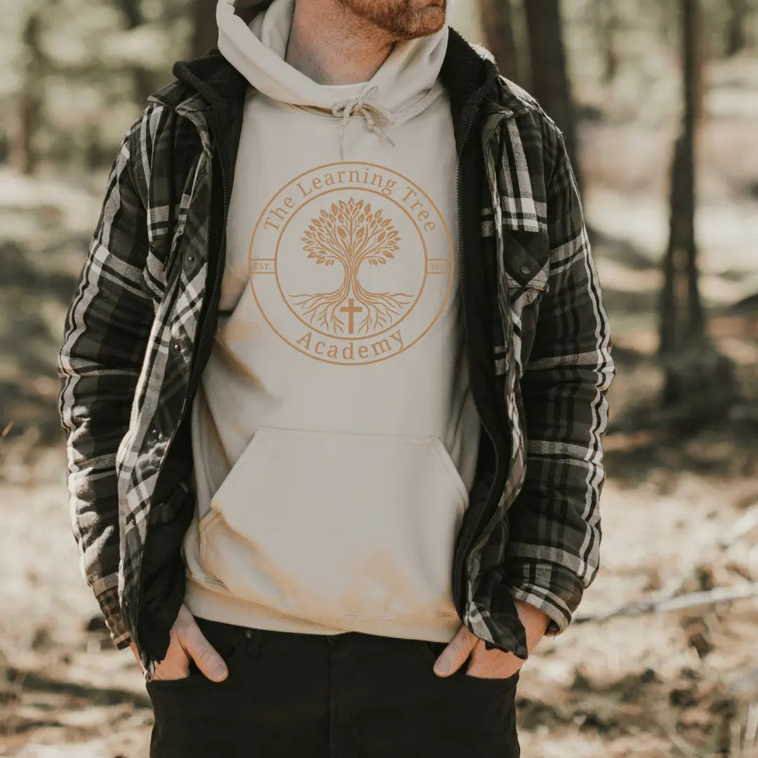 Beige hoodie from Winks Design Studio featuring The Learning Tree Academy logo, casual style with front pocket and hood.