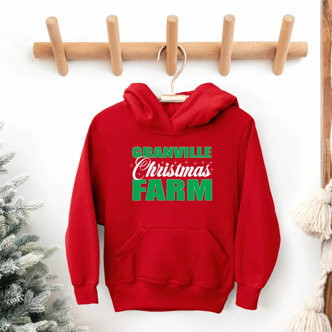 Black Granville Christmas Farm Kids Hoodie by Winks Design Studio, LLC, featuring festive holiday farm graphic for children.