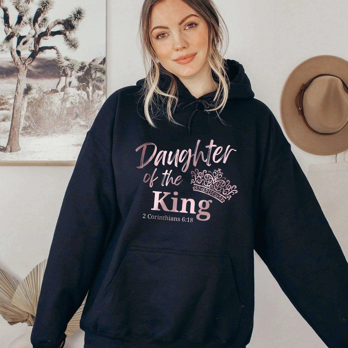 Daughter Of The King front pocket hoodie by Winks Design Studio, LLC, in soft fabric with a casual fit and front pocket detail.