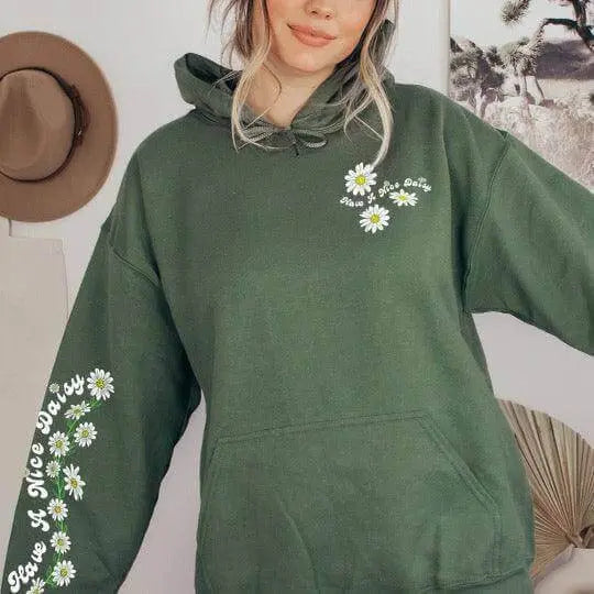 Winks Design Studio LLC Have a Nice Daisy front pouch hoodie in soft fabric with floral daisy design on the front.