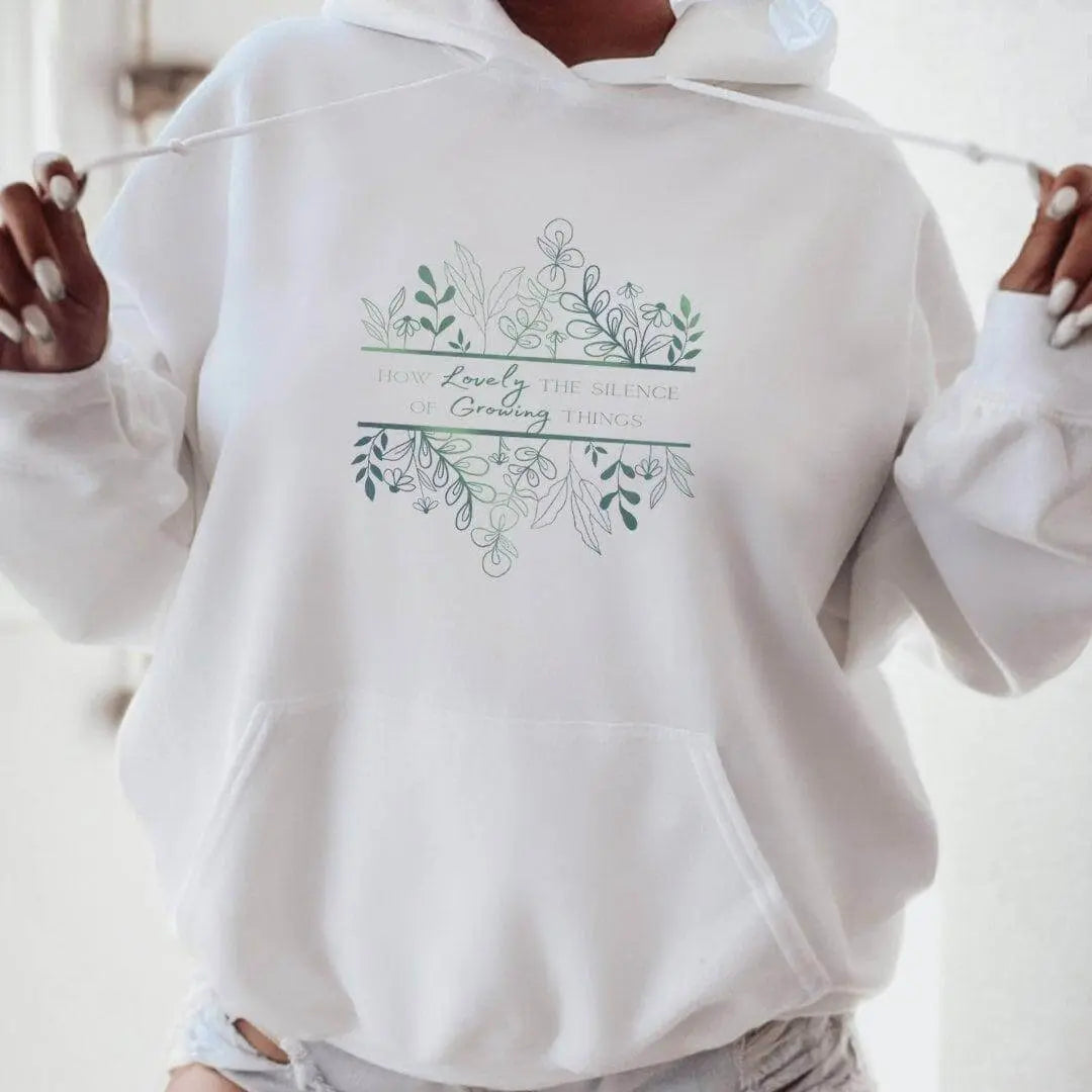 Winks Design Studio hoodie featuring the phrase "How Lovely the Silence of Growing Things," shown in a cozy, soft fabric.